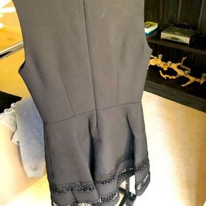 Black midi length dress with lace trim